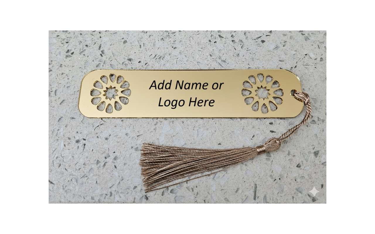 Gold bookmark with decorative ends and text 'Add Name or Logo Here' on a textured surface