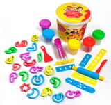 Colorful play dough set with tools and containers on a white background