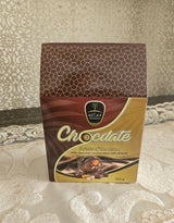 Chocolate packaging with a decorative pattern on a textured surface